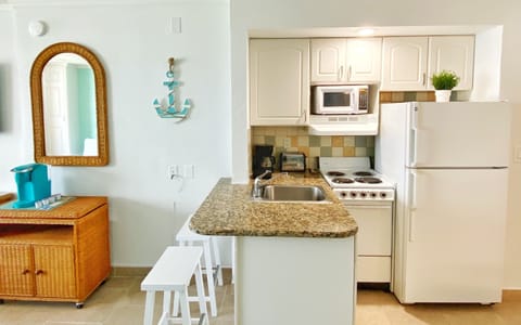 Exclusive Studio, 1 Queen Bed, Ocean View | Private kitchen | Mini-fridge, microwave, stovetop, coffee/tea maker