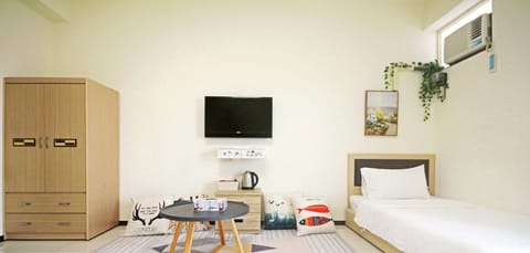 Quadruple Room | Living area | Flat-screen TV
