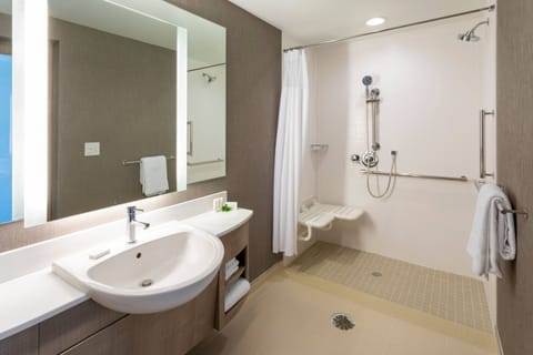 Suite, 1 King Bed (Hearing Accessible) | Bathroom | Free toiletries, hair dryer, towels