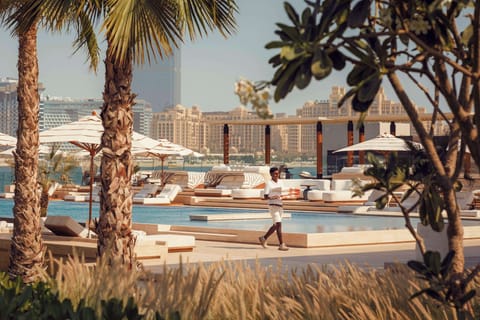 Outdoor pool, pool umbrellas, sun loungers