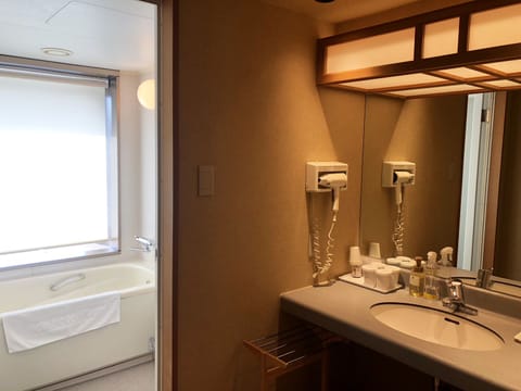 Deluxe Quadruple Room, Non Smoking | Bathroom | Hair dryer, slippers, electronic bidet, towels