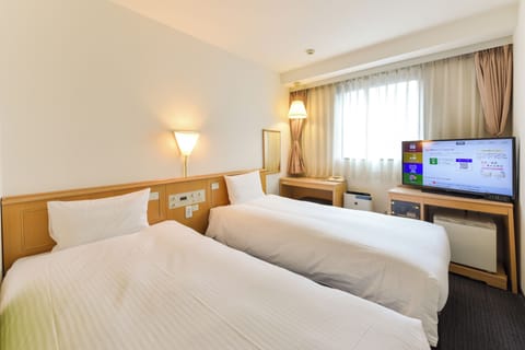 Economy Twin Room, 2 Single beds, Non Smoking (15sqm) | Down comforters, desk, blackout drapes, free WiFi