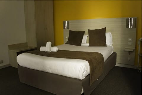 Desk, laptop workspace, blackout drapes, soundproofing