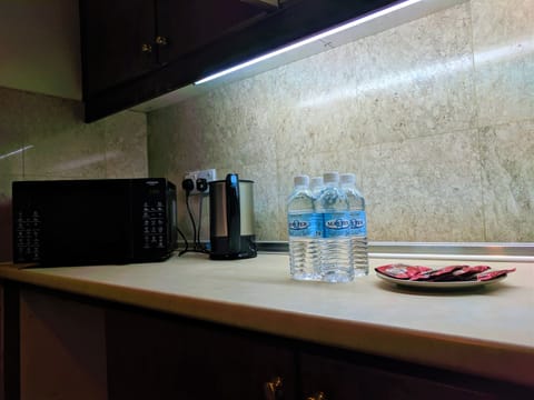 Superior Suite | Private kitchen | Fridge, microwave, stovetop, electric kettle