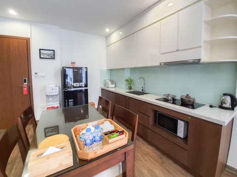 Suite, 2 Bedrooms | Private kitchen | Mini-fridge, stovetop, dishwasher, electric kettle