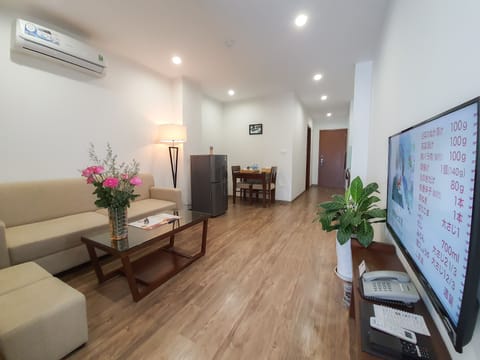 Luxury Double Room | Living room | 50-inch LCD TV with premium channels, TV
