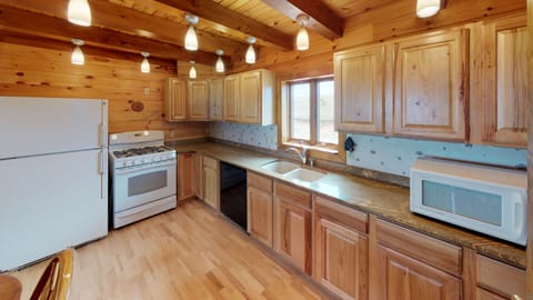 The kitchen has plenty of counter space and everything you need to cook meals. 
