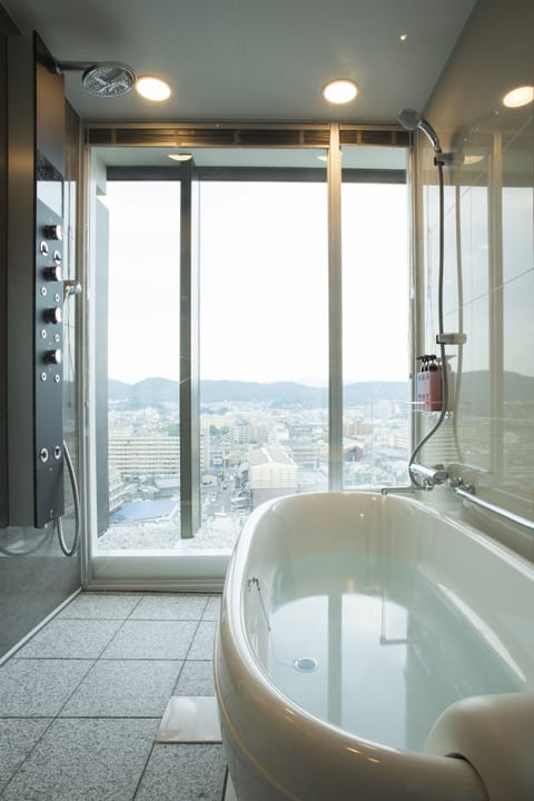 13th Floor Junior Suite, City View, Non Smoking | Bathroom | Combined shower/tub, free toiletries, hair dryer, slippers