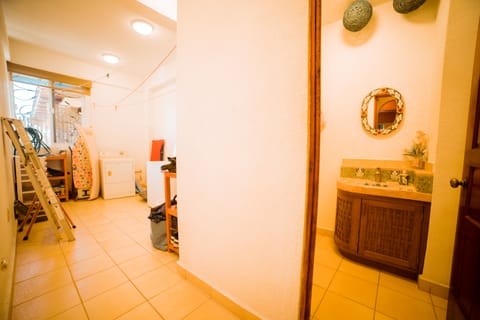 Utility room with washing machine and washroom