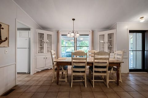Dining room table for six features a view of the backyard