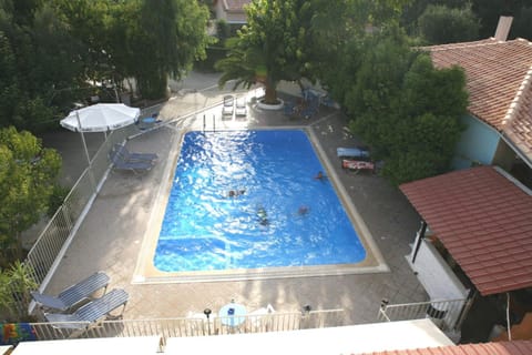 Seasonal outdoor pool, open 8:00 AM to 8:00 PM, pool umbrellas