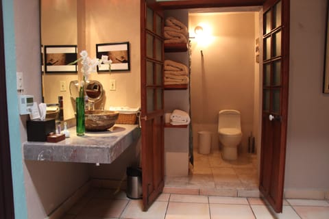 Deluxe Room, 2 Queen Beds | Bathroom | Shower, rainfall showerhead, designer toiletries, hair dryer