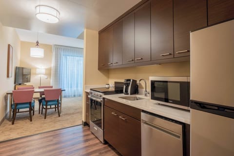 Suite, 1 Bedroom | Private kitchen | Fridge, microwave, stovetop, dishwasher