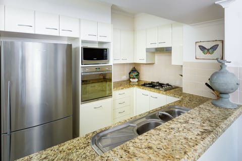 Two Bedroom Apartment | Private kitchen | Full-size fridge, microwave, oven, stovetop