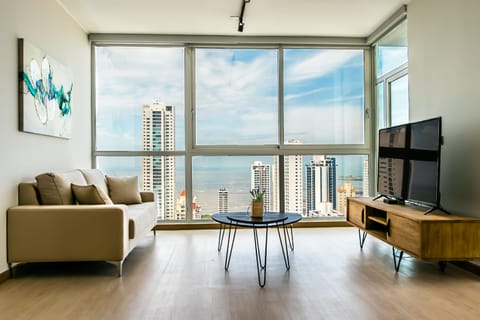Deluxe Apartment, 3 Bedrooms | Living area | Smart TV