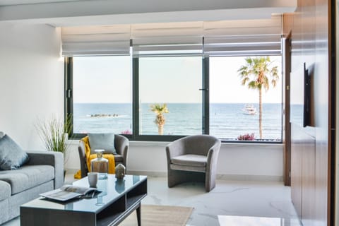 Luxury Apartment, Sea View | Living area | 43-inch flat-screen TV with cable channels, TV