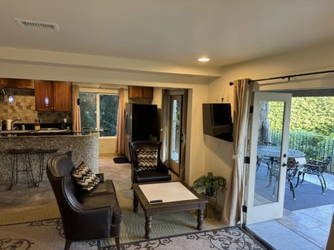 The studio opens to a large furnished and covered patio through 2 French doors.