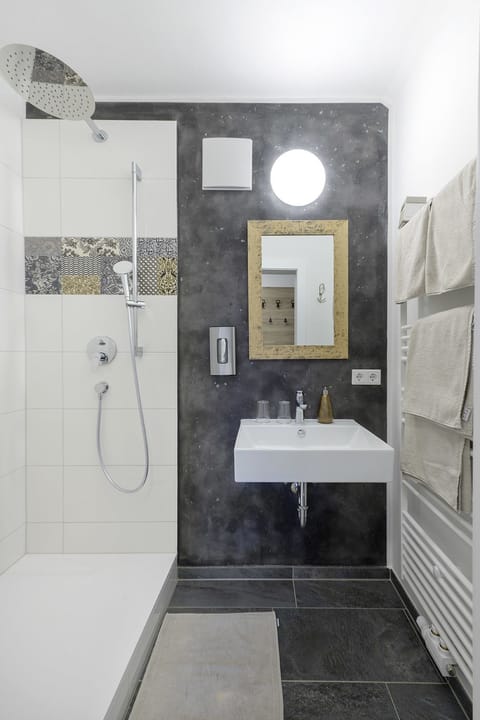 Superior Apartment, Kitchenette | Bathroom | Shower, hair dryer, bathrobes, towels
