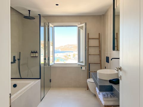 Executive Suite, Sea View | Bathroom | Hair dryer, bathrobes, towels