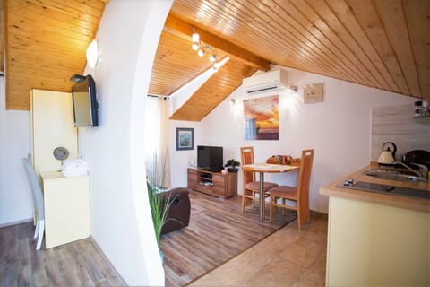 Economy Apartment, 1 Queen Bed, Terrace | Private kitchenette | Fridge, electric kettle