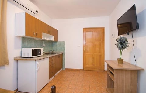 Apartment (Apartments Čiovo - Basic Two Bedroom) | Private kitchen | Fridge, microwave, stovetop, coffee/tea maker