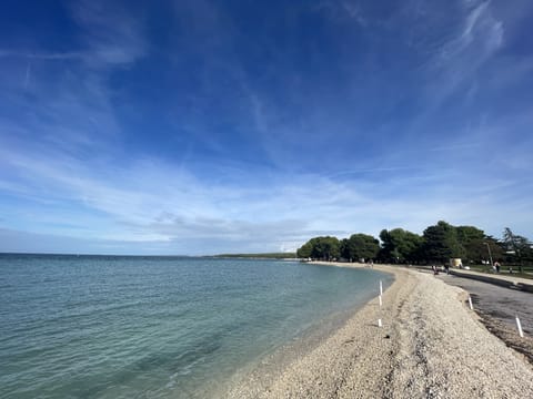 Beach nearby, white sand, sun loungers, beach umbrellas