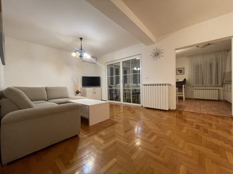 Family Apartment, 3 Bedrooms | Living area | Flat-screen TV