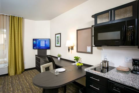 Studio Suite, 1 Queen Bed | Private kitchen | Full-size fridge, microwave, stovetop, dishwasher