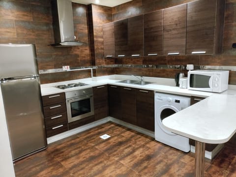 Executive Suite, 1 Bedroom, City View | Private kitchen | Fridge, electric kettle, highchair, paper towels