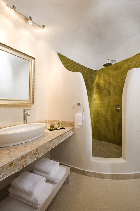 Junior Suite, Caldera View | Bathroom | Shower, rainfall showerhead, designer toiletries, hair dryer