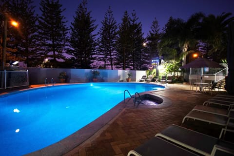 Outdoor pool, open 7 AM to 9 PM, pool umbrellas, sun loungers