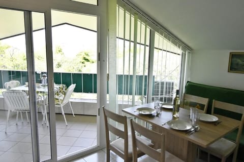 The exit to the balcony from the dining room