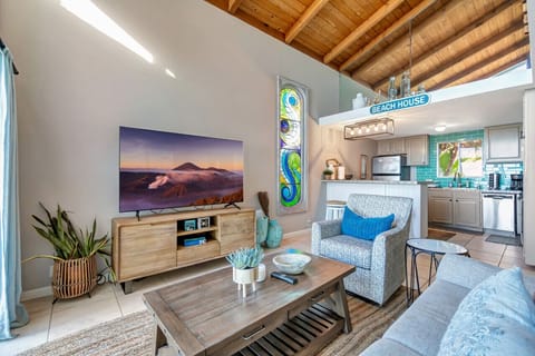 Rustic wooden beams enhance the living room's charm