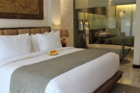 Suite Pool View | Pillowtop beds, minibar, in-room safe, individually decorated