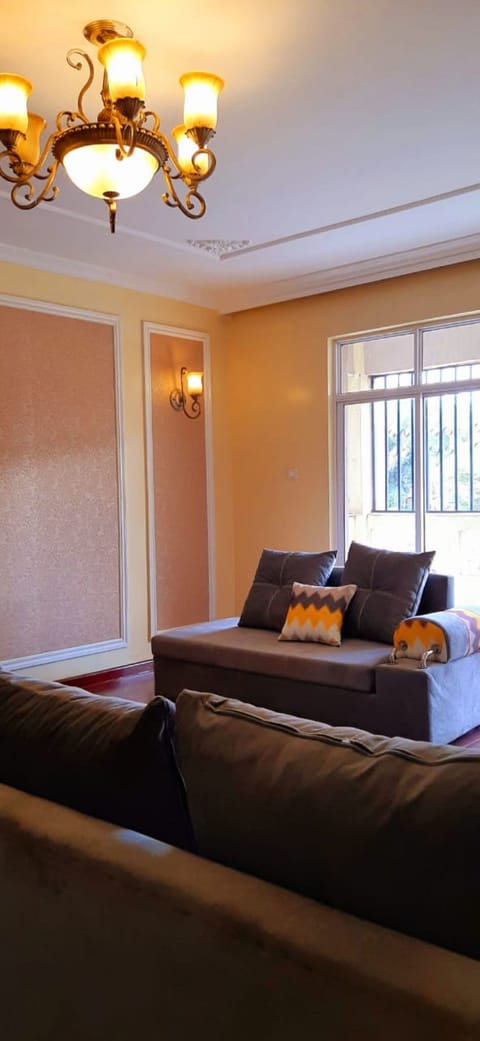 Apartment, 4 Bedrooms | Living area | Flat-screen TV