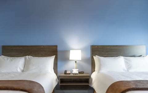 Premium bedding, pillowtop beds, desk, laptop workspace