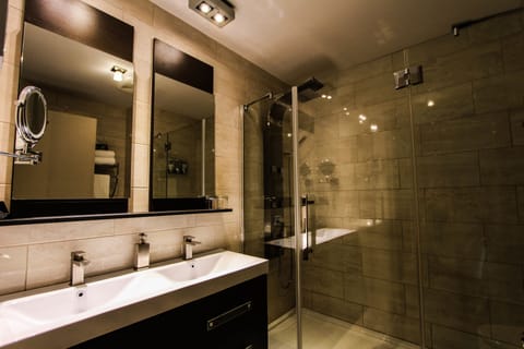 Combined shower/tub, designer toiletries, hair dryer, bathrobes