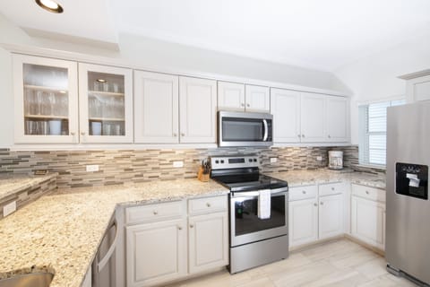 Ground Floor Private Oasis | Private kitchen | Full-size fridge, microwave, oven, stovetop