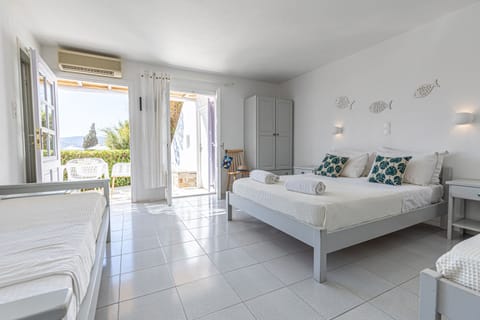 Standard Quadruple Room, Sea View | Premium bedding, in-room safe, individually decorated