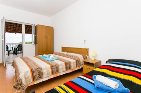 Triple Room, Terrace, Sea View | Bed sheets