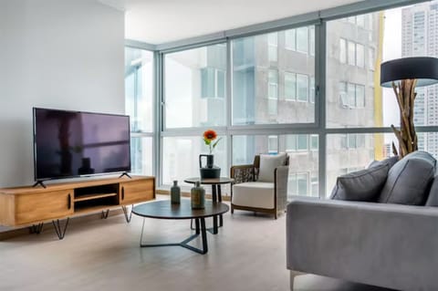 Deluxe Apartment, 3 Bedrooms | Living area | Smart TV