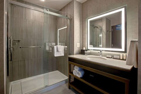 Suite, 1 King Bed | Bathroom | Combined shower/tub, towels