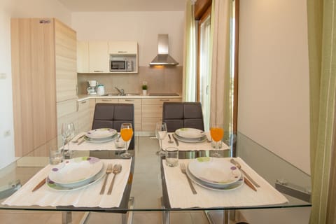 Superior Apartment, 2 Bedrooms, Sea View | Private kitchen | Fridge, microwave, stovetop, coffee/tea maker