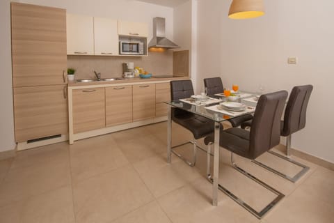 Superior Apartment, 1 Bedroom, Partial Sea View | Private kitchen | Fridge, microwave, stovetop, coffee/tea maker