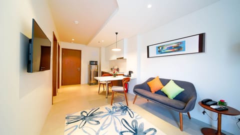 Suite, 1 Bedroom (guests age 18-59) | Living area | 32-inch LCD TV with cable channels, TV