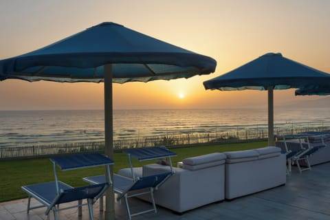 On the beach, sun loungers, beach umbrellas, beach towels