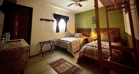 Habitación Doble Individual | Down comforters, individually decorated, individually furnished, desk