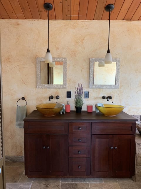 Double sinks in upstairs bedroom private bathroom