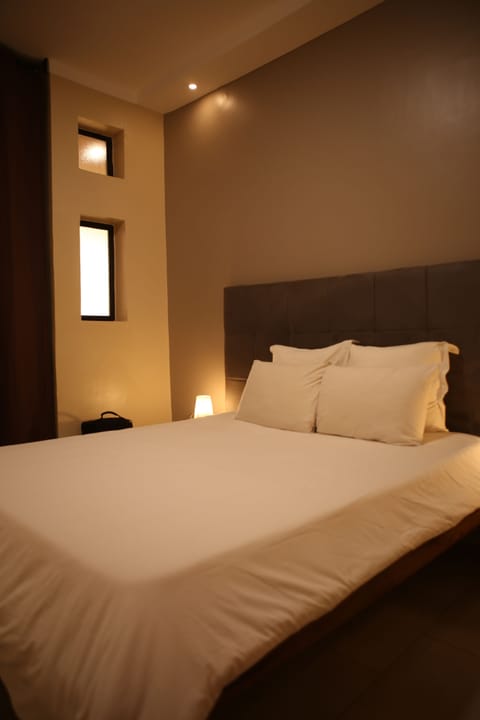 Premium Suite | Premium bedding, blackout drapes, soundproofing, free WiFi