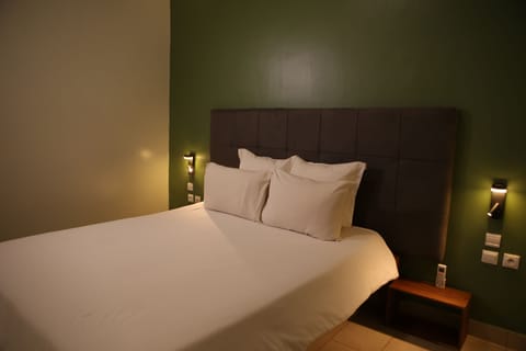 Standard Suite | Premium bedding, blackout drapes, soundproofing, free WiFi